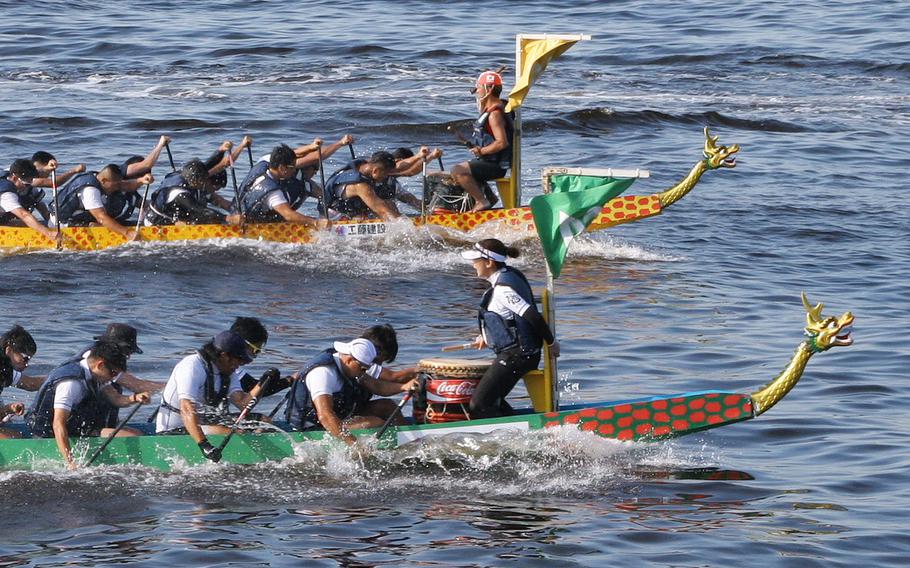 Two dragon boats racing.